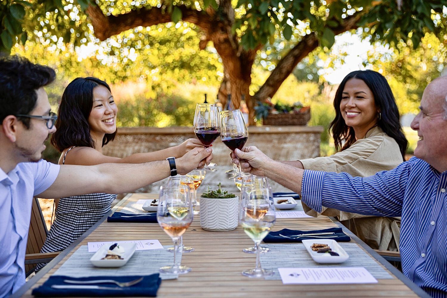 People cheers-ing at a table at the Kendall-Jackson Wine Estate & Gardens